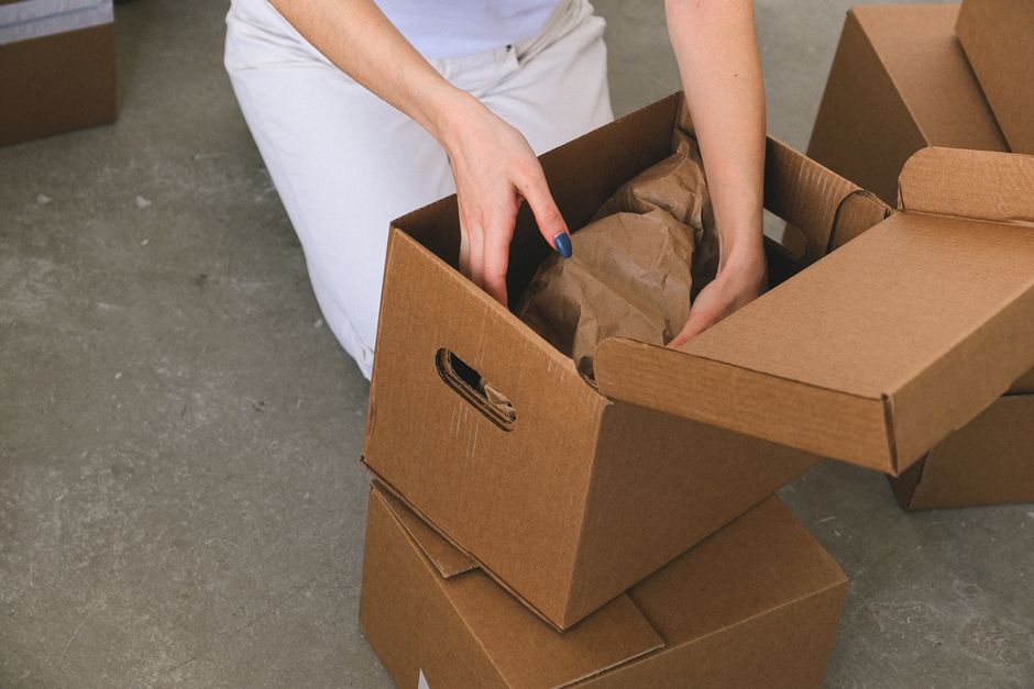 Expert packing cardboard boxes for a move